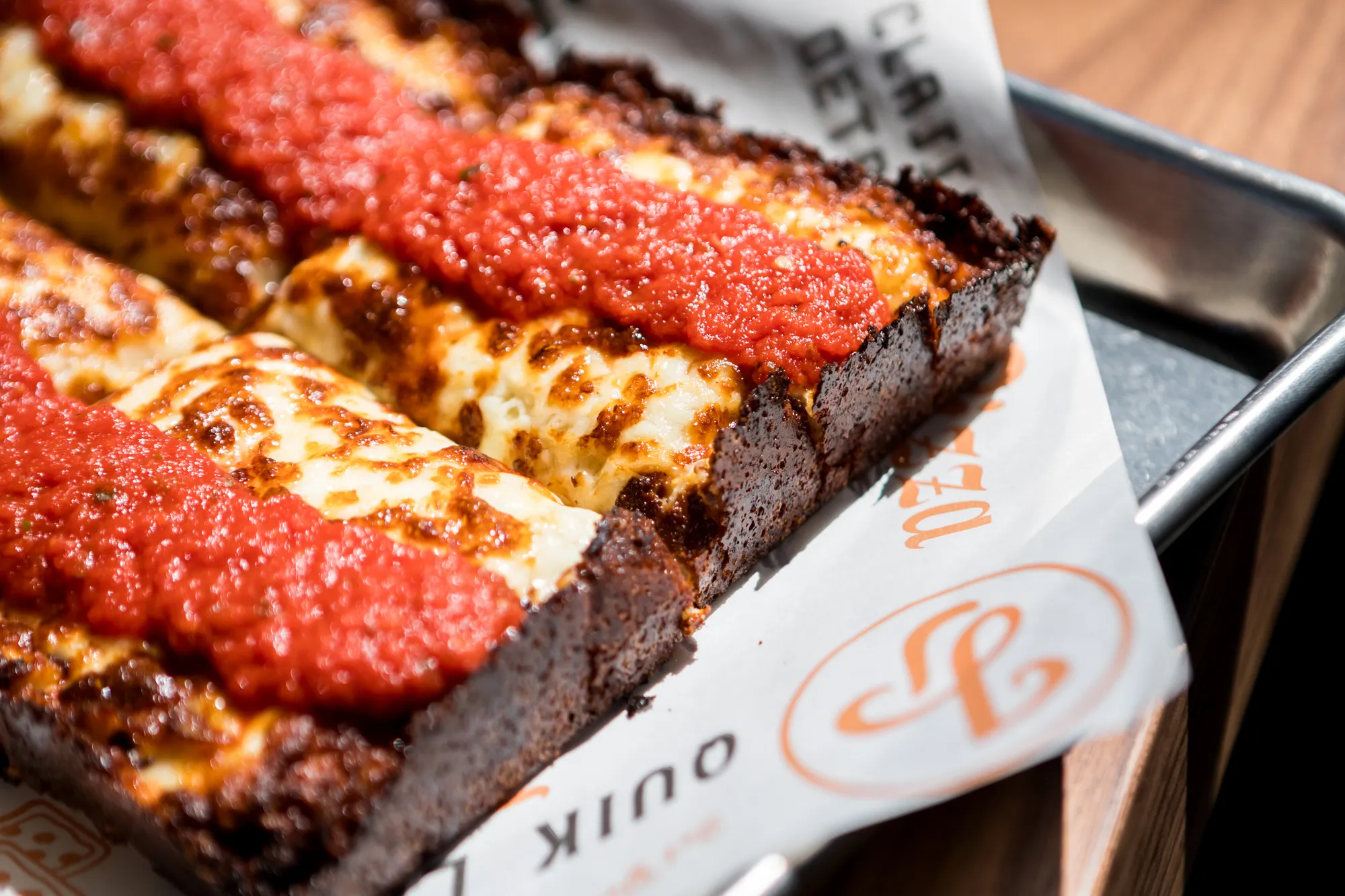 Buffalo chicken Detroit-style pizza on a Joyride Pizza tray