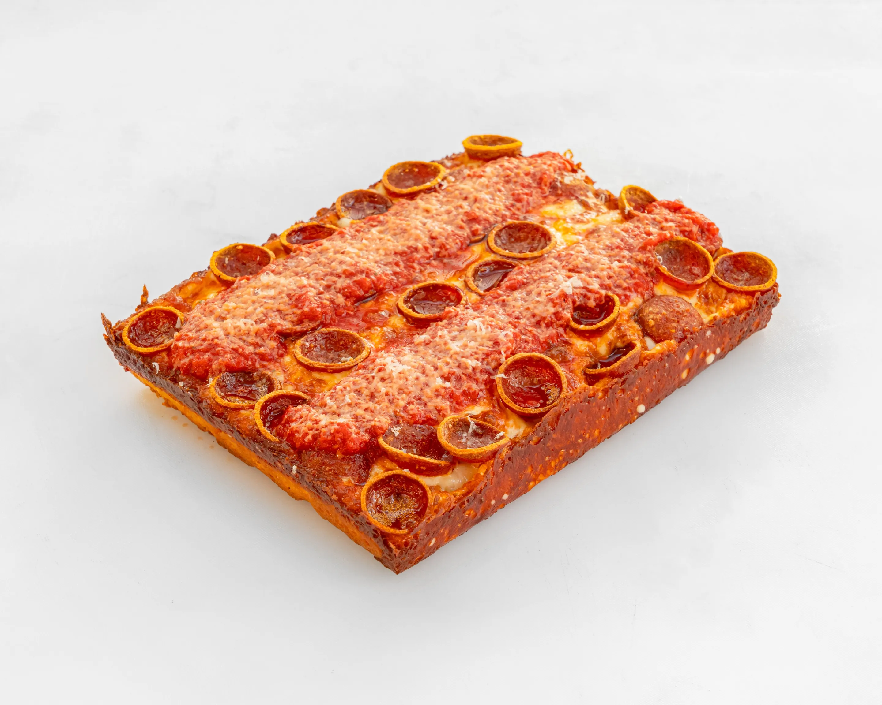 A Joyride Detroit-style square pizza piled with crispy cup-and-char pepperoni.